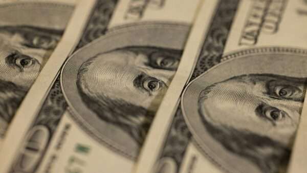 close up of multiple $100 bills | Photo by engin akyurt on Unsplash