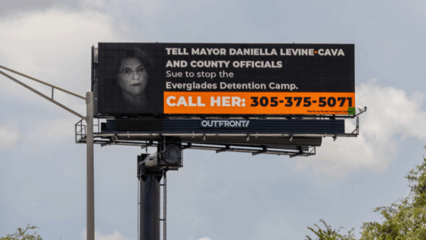 A billboard reading "Tell Mayor Daniella Levine Cava and County Officials: Sue to stop the Everglades Detention Camp" | Florida Immigrant Coalition