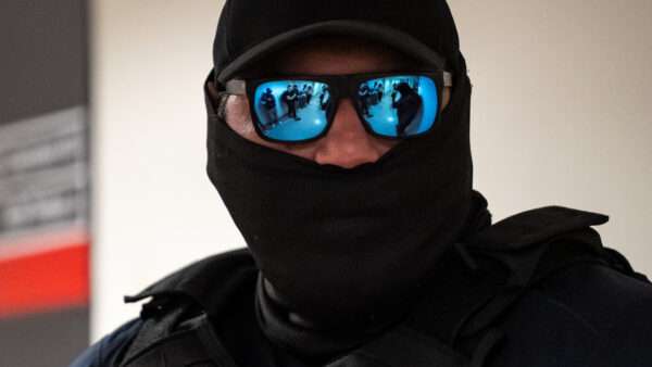 masked ICE agent | ANGELINA KATSANIS/UPI/Newscom