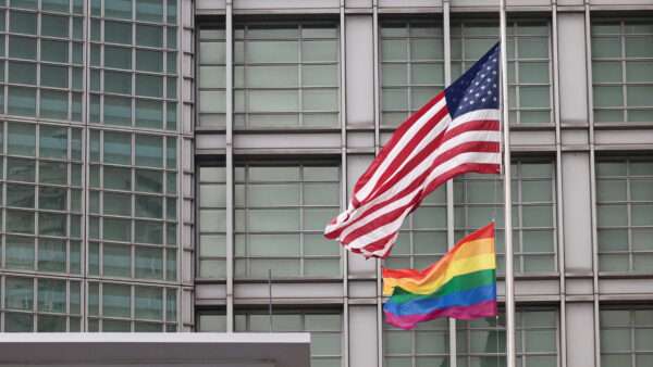 A rainbow flag and an American flag wave over the U.S. Embassy in Moscow in 2023. | Valery Sharifulin/ZUMAPRESS/Newscom