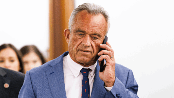 Robert F. Kennedy Jr. holding a cell phone to his ear | Aaron Schwartz/Sipa USA/Newscom