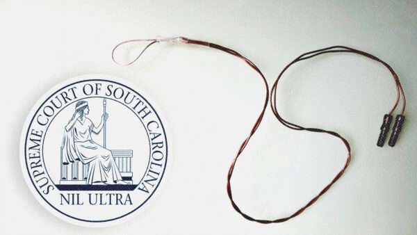 the seal of the South Carolina Supreme Court next to a photo of a penile plethysmograph | South Carolina Supreme Court/Wikipedia/Wikimedia Commons