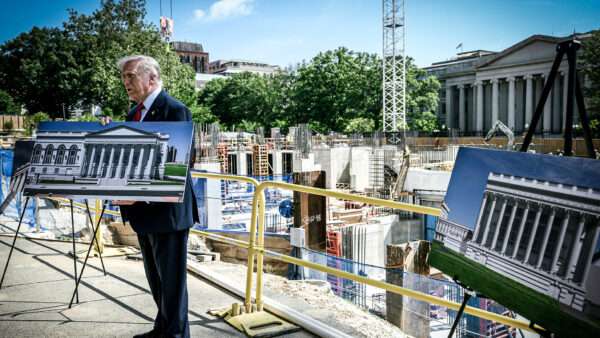 President Donald Trump displays pictures of the White House ballroom project | Joyce N. Boghosian/Newscom