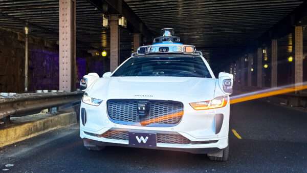 A Waymo driverless vehicle drives through a tunnel | Tom Williams/CQ Roll Call/Newscom