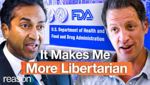 Vinay Prasad appears on the left. Zach Weissmueller appears on the right. An image of the FDA headquarters signage appears behind them. Bold text across the bottom of the screen reads "It Makes Me More Libertarian." | Illustration: Adani Samat