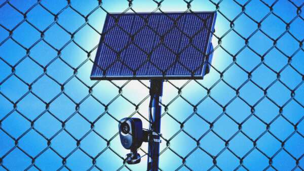 A Flock automated license plate reader on a pole with a solar panel, behind a fence. | Illustration: Feng Yu/Dreamstime/Charles McClintock Wilson/ZUMAPRESS/Newscom