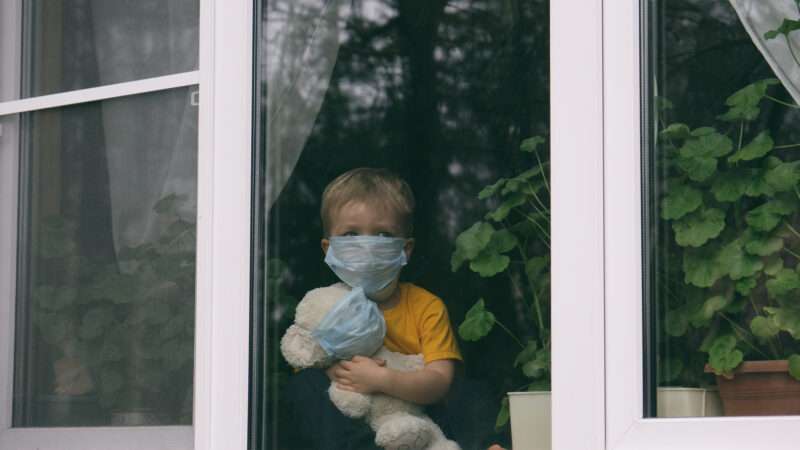 dreamstime_xxl_175304249 | Photo <a href="https://www.dreamstime.com/stay-home-quarantine-coronavirus-pandemic-prevention-sad-child-his-teddy-bear-both-protective-medical-masks-sits-image175304249">175304249</a> © <a href="https://www.dreamstime.com/gargonia_info" itemprop="author">Tatiana Kozachenko</a> - <a href="https://www.dreamstime.com/photos-images/quarantine.html">Dreamstime.com</a>