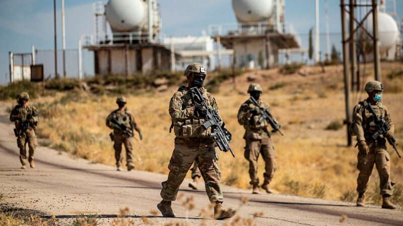 featuresyria2 | U.S. soldiers patrol near an oil production facility in Syria’s northeastern Hasakah Province; Delil Souleiman/AFP/Getty Images