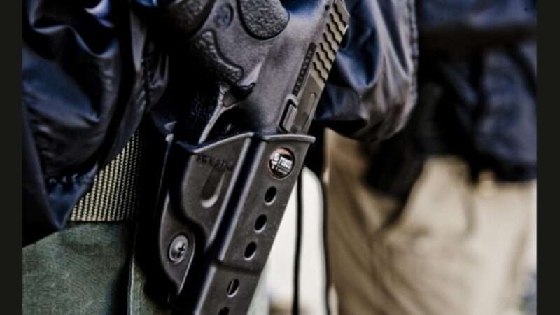handgun in holster | Ben Otano/Flickr