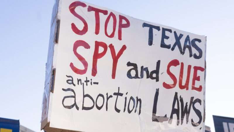 Texas-abortion-law-protest-sign-2-Newscom-cropped