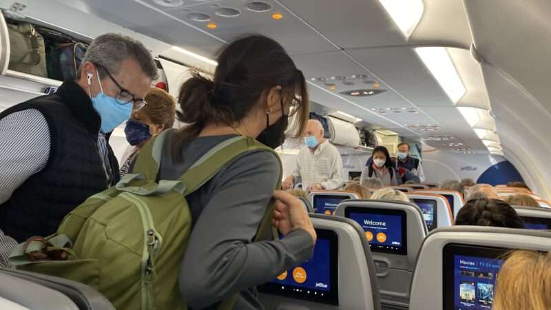 masked-airplane-passengers-4-13-22-Newscom
