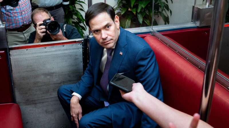 Senator Marco Rubio sits on a transport car under the United States Capitol, surrounded by reporters | Michael Brochstein/Sipa USA/Newscom