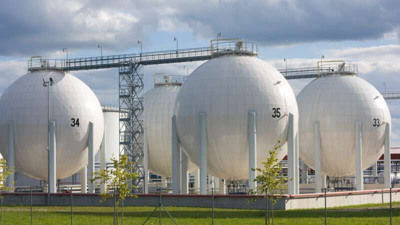 Multiple industrial oil storage tanks.
