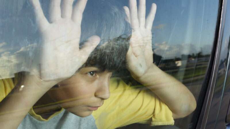 Boy behind a car window | Photo 6430900 © Felix Mizioznikov | Dreamstime.com