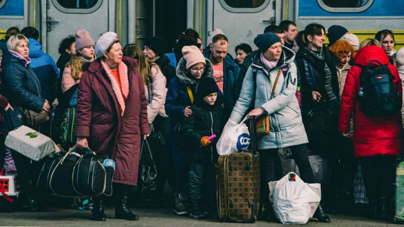 Ukrainian refugees wait to board a train in March 2022 | Lara Hauser/ZUMAPRESS/Newscom