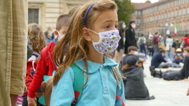 Schoolchildren in masks.