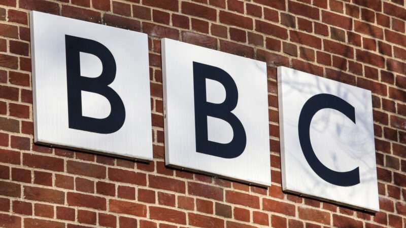 The BBC logo against a brick wall. | Chris Dorney | Dreamstime.com