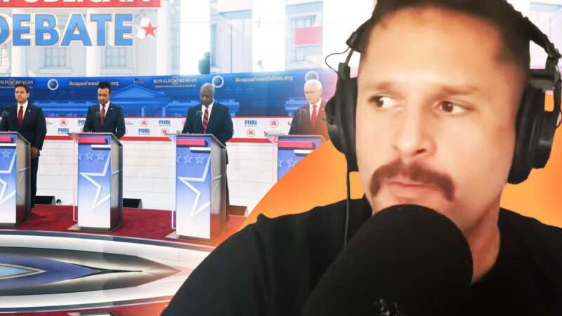 Josh Barro speaks into microphone, GOP candidates in background | Lex Villena