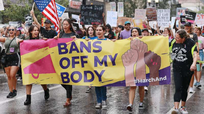 Pro-choice protesters march with a sign that says "Bans Off My Body" | New data shows almost 50,000 more abortions in the first six months of 2023 than during the same period in 2020.