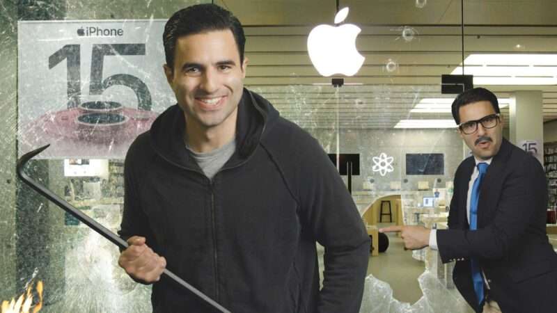 Remy with crowbar in front of a smashed Apple Store | Reason TV