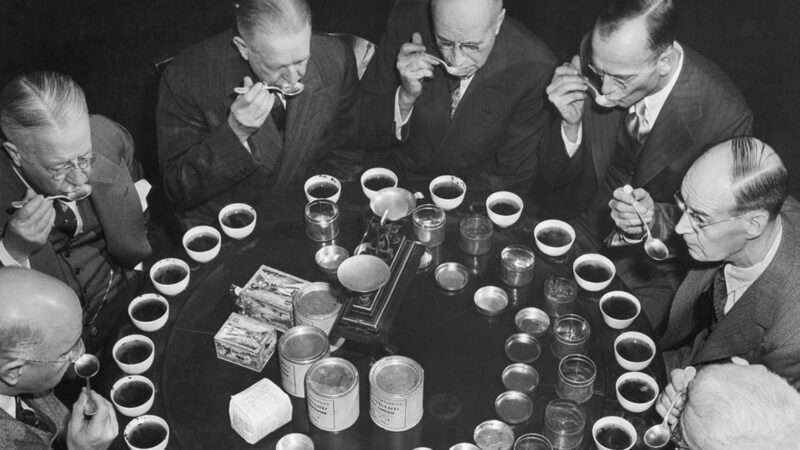 Members of the federal tea board sit around a table to taste tea | Photo: Members of the Board of Tea Experts meet to taste teas, 1947; Getty