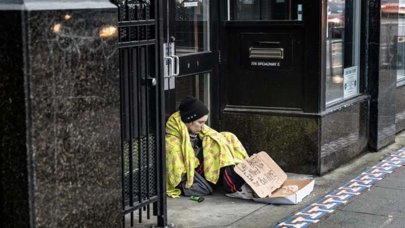 Homeless person sitting outside store | Tom Kirkendall/ZUMAPRESS/Newscom
