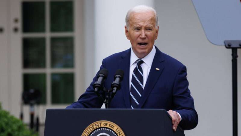 Joe Biden speaks at a lectern with the presidential seal | CHINE NOUVELLE/SIPA/Newscom