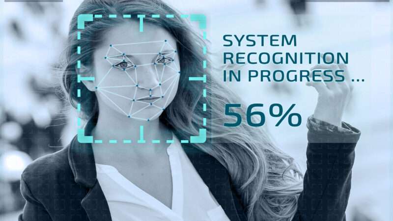 Simulation of facial recognition technology through a closed circuit television camera, in which a box displayed around a woman's face reads 