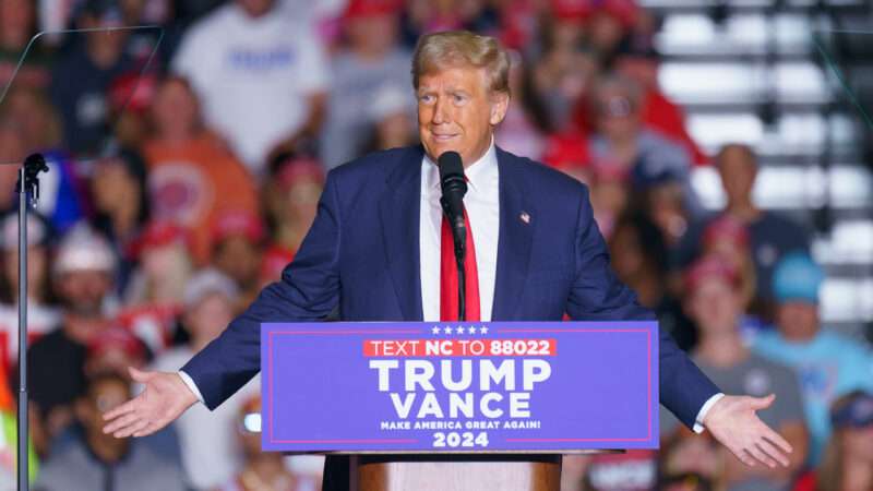 Donald Trump speaks at a podium at a campaign rally | Josh Brown/ZUMAPRESS/Newscom