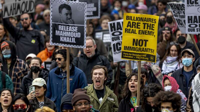 Protesters carry signs in support of releasing Mahmoud Khalil | Michael Nigro/Zuma Press/Newscom