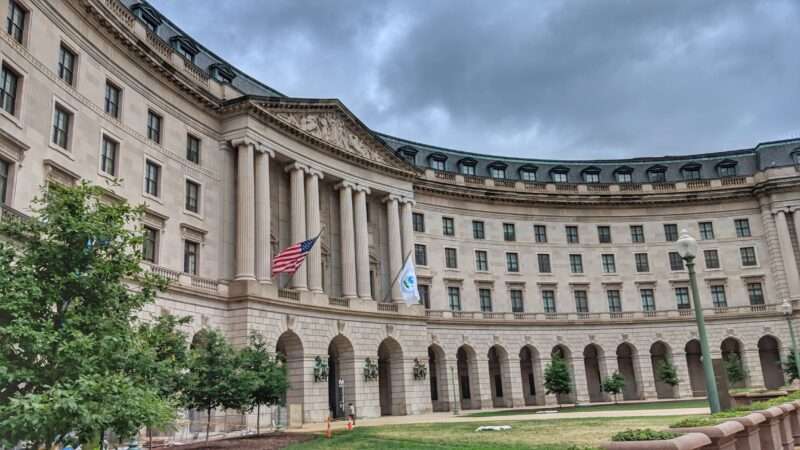 The exterior of the Environmental Protection Agency (EPA) headquarters in Lafayette Square in Washington, D.C., under a sky of dark clouds. | Vkkarri | Dreamstime.com