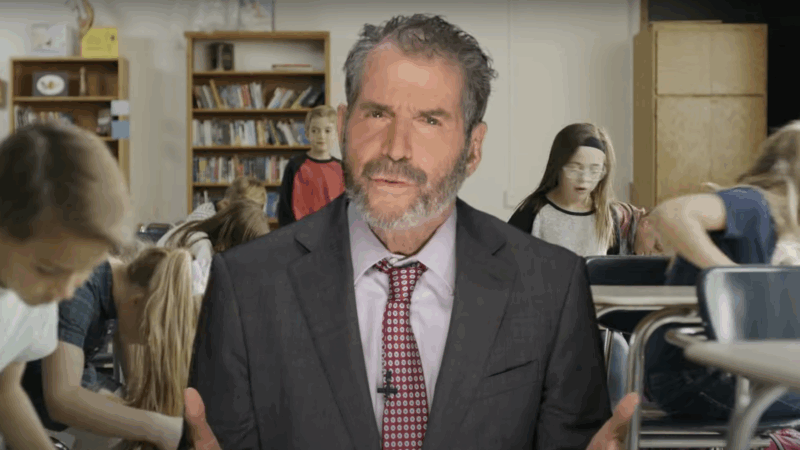John Stossel is seen in front of students in a classroom | Stossel TV