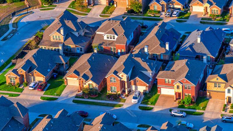 An aerial view of suburban houses | Photo: Art Wager/iStock
