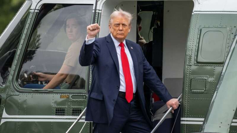 President Donald Trump pumps his fist while boarding a helicopter on the South Lawn of the White House | Joey Sussman/Zuma Press/Newscom