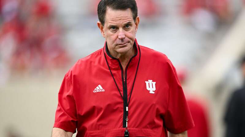 Indiana football coach Curt Cignetti walks toward the camera with a blurred stadium background behind him. | ames Black/Icon Sportswire DHN/James Black/Icon Sportswire/Newscom