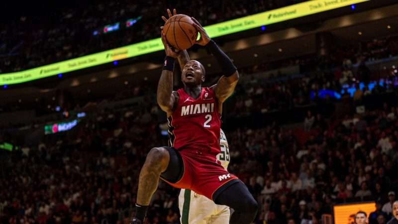 Miami Heat guard Terry Rozier wears a red jersey, and is mid-air with a basketball in his hands. | D.A. Varela/TNS/Newscom