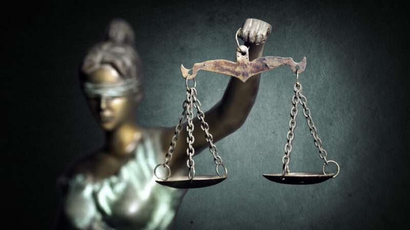 Lady Justice statue, holding scales, with a blindfold over her eyes. | Piatroderbrado | Dreamstime.com