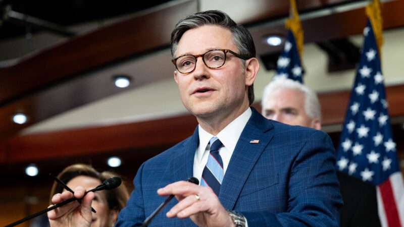 Mike Johnson stands in front of people and flags and speaks | Michael Brochstein/Sipa USA/Newscom