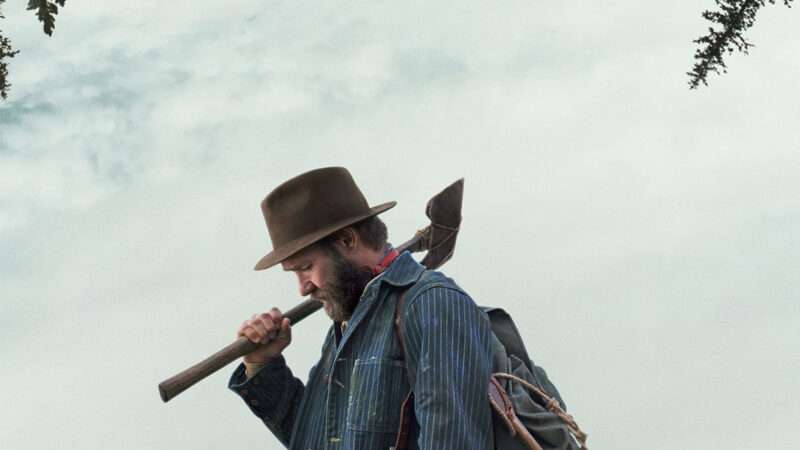 A man holding a hatchet | Black Bear and Kamala Films