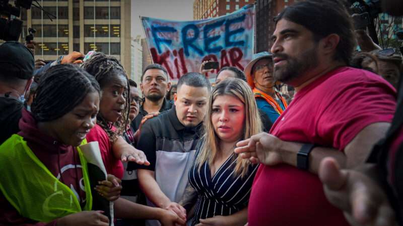 Kilmar Abrego Garcia moves through a crowd of supportive protesters. A sign says "Free Kilmar." | Carol Guzy/ZUMAPRESS/Newscom