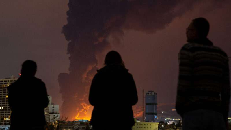 Smoke billowing over a skyline | Arash Khamooshi/Polaris/Newscom