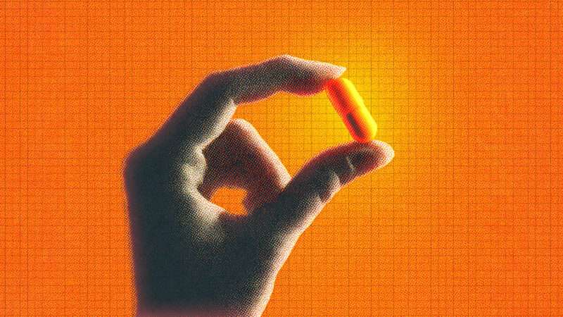 A hand holds a pill against an orange background | Midjourney