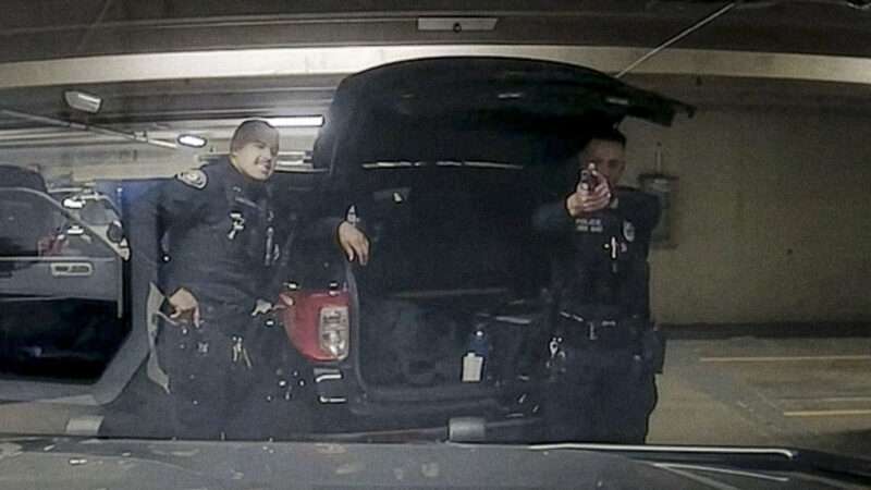 Still image from dash camera footage of Pasadena Police officers engaging in "horseplay" with their guns. | Pasadena Police Department