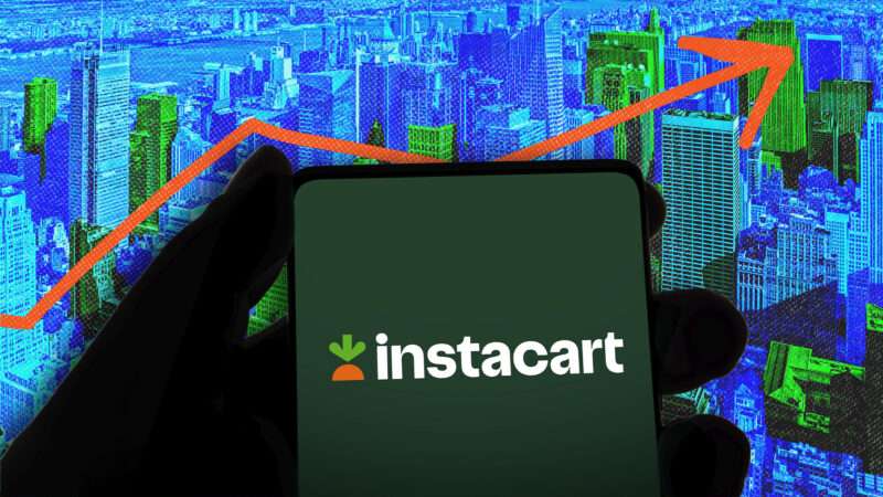 A phone with the Instacart logo against a backdrop of New York City | Illustration: Brett Critchley/Dreamstime/imageBROKER/Md Mamun Miah/Newscom