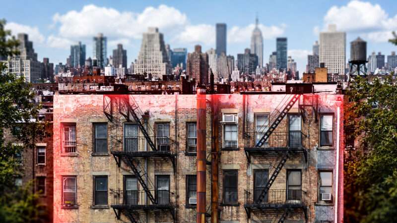 A rundown-looking apartment building is outlined in bright red—in the background is part of the New York City skyline. | Illustration: Adani Samat/ChatGPT. Photo: Ryan Deberardinis/Dreamstime