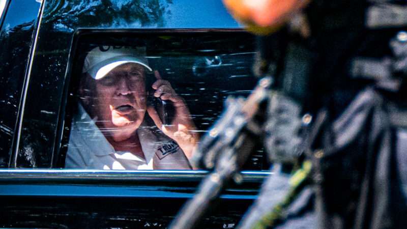 Donald Trump speaking on the phone in a car | Matt Kaminsky/ZUMAPRESS/Newscom