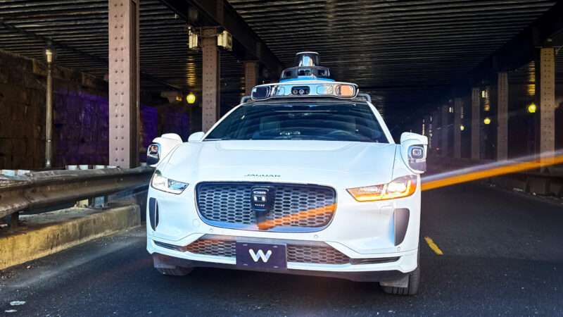 A Waymo driverless vehicle drives through a tunnel | Tom Williams/CQ Roll Call/Newscom