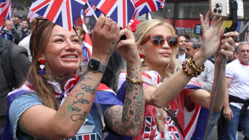 Citizens waving British flags in the street | Teun Voeten/Sipa USA/Newscom