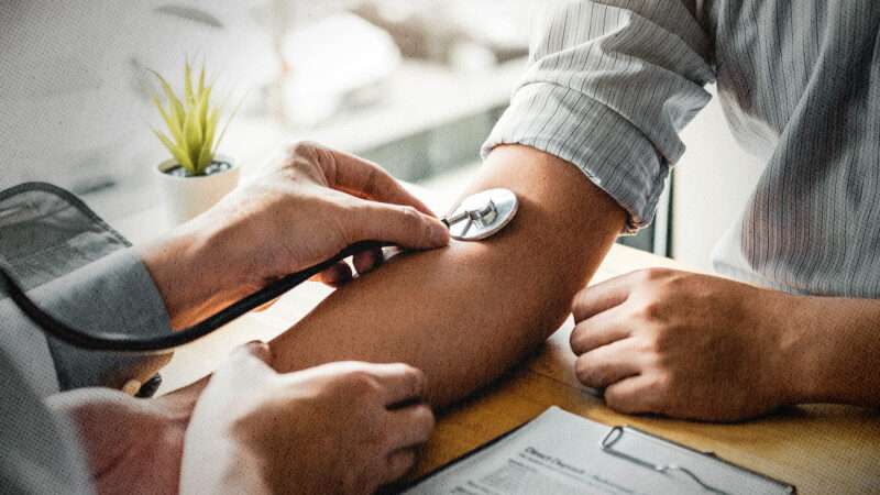 Doctor taking patient pulse | Sarinya Pinngam/Dreamstime