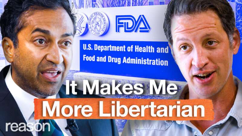 Vinay Prasad appears on the left. Zach Weissmueller appears on the right. An image of the FDA headquarters signage appears behind them. Bold text across the bottom of the screen reads "It Makes Me More Libertarian." | Illustration: Adani Samat